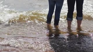 Couple Standing On The Beach Stock Video