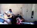 Jikelele khumalo playing his guitar  with Sbu