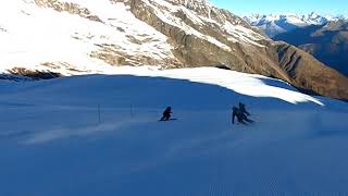Ski instructors skiing on empty slopes in Saas-Fee