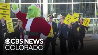 Flight attendants for United Airlines demonstrate at DIA during contract negotiations