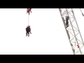 woman stuck on crane in toronto rescued by firefighter