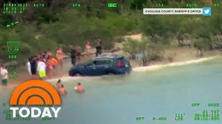 Alleged drunk driver speeds down beach, car ends up in water