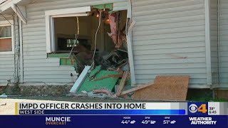 IMPD officer crashes into home