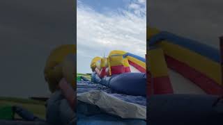 Bouncing on deflating inflatable bounce house slide