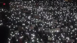 University students lead noisy protest outside Serbia's state television headquarters in Belgrade