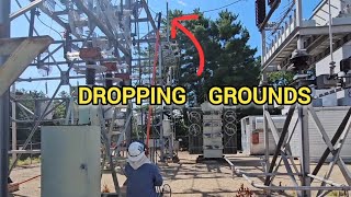 Dropping grounds in a high voltage substation after repairs are complete