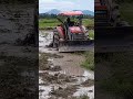 kubota m6040su tractor and disc vs. mud 1348