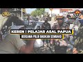 Pelajar Asal Papua Bersama Polri Bagikan Sembako