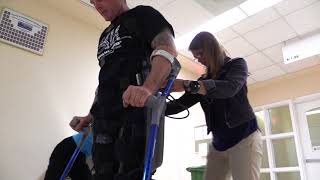 Paraplegic man walks with robotic exoskeleton