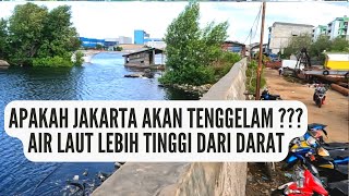 GAWAT air laut lebih tinggi dari darat tanggul sebagai penahan air untuk mencegah tenggelam