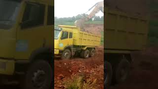 This small FAW  290 Truck  and This is Excavation Excavator machine D 329 Loading