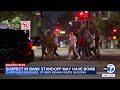 2 hostages released, standoff with man after bomb threat at Bakersfield bank building stretches on