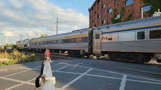 Two Via Rail trains passing by the Saint-Ambroise crossing in the  Saint-Henri area of Montreal 🚃