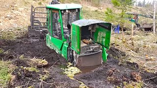 John Deere tractor stuck deep in mud