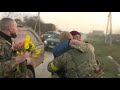 Villagers greet Ukrainian soldiers with flowers