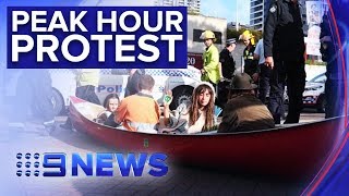 Climate protestors cause traffic headaches in Brisbane's CBD | Nine News Australia