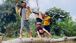 Agricultural vehicle transporting wood; a girl single-handedly felling a giant tree.