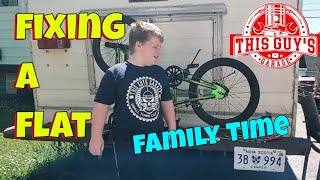 patching a bicycle tube, a father and son project