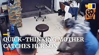 Quick-thinking mother catches her son in nick of time in China