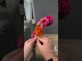 making a flower crown with real flowers. zinnias and marigolds