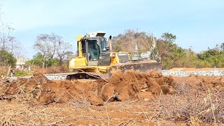 Perfect Extreme Bulldozer Operator Komatsu Clearing stones for new roads.