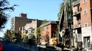 WALKING BY CONSTRUCTION ON FRONTENAC STREET IN MONTREAL EAST