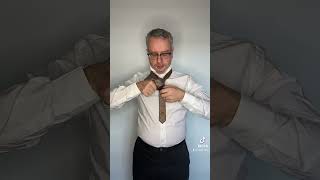 How to tie a Double Windsor knot.