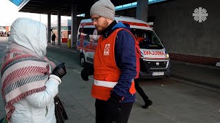 Two CARITAS volunteers at the POLISH-UKRAINIAN border