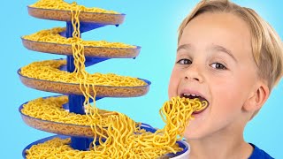 Kids learn teamwork and make rainbow noodles
