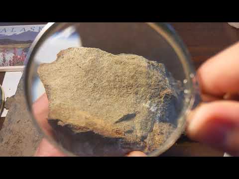 How is conglomerate different from sandstone?