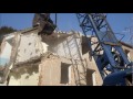 demolition a building by a menck m154 clamshell crane canon 7d