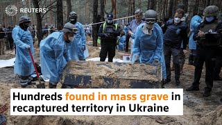 Hundreds found in mass grave in recaptured territory in Ukraine