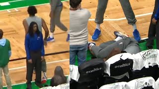 Joel Embiid rolls ankle on security and falls into front row during pregame warmups