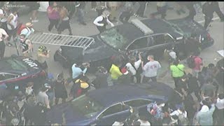 Protesters smash windows of Atlanta Police cars