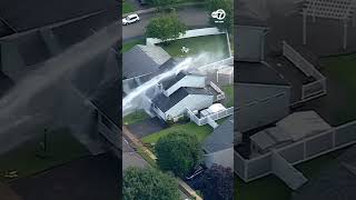 Water douses a house at a high rate of speed after a water main break in Edison, New Jersey