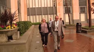 RAW: Former FCI Dublin warden blocks TV camera with folder ahead of sentencing