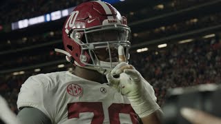 Alabama players celebrate in Auburn student section