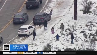 Residents flock to snow covered SoCal mountains