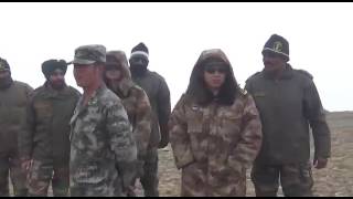 Indian and Chinese soldiers pushing each other