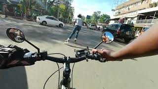 WOW! Bike Cyclist vs Inline Skater Race in Nairobi CBD Moi Avenue Kenya Africa