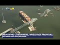 Cranes move wreckage from Key Bridge collapse