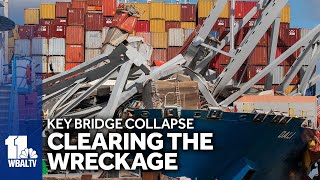 Cranes move wreckage from Key Bridge collapse