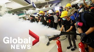 Hong Kong protesters standoff against police after sit-in at Yuen Long station