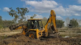 JCB Backhoe in Action: Clearing the Outer Layer for a Pristine Pond Transformation