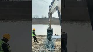 Use Excavator to Load Stones Into Metal Cage