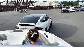 Tesla model X towing a Yamaha boat