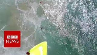 Swimmers rescued by drone in Australia - BBC News