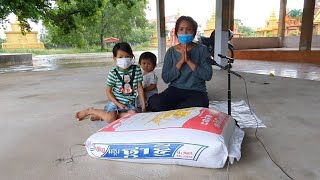 Brother Seng and his Khmer-French family donate rice and money to poor young sister Lek Karuna