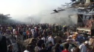 Explosion at market kills at least 54 people