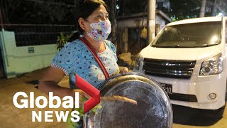 Myanmar coup: Yangon residents bang pots and pans to “drive out” military